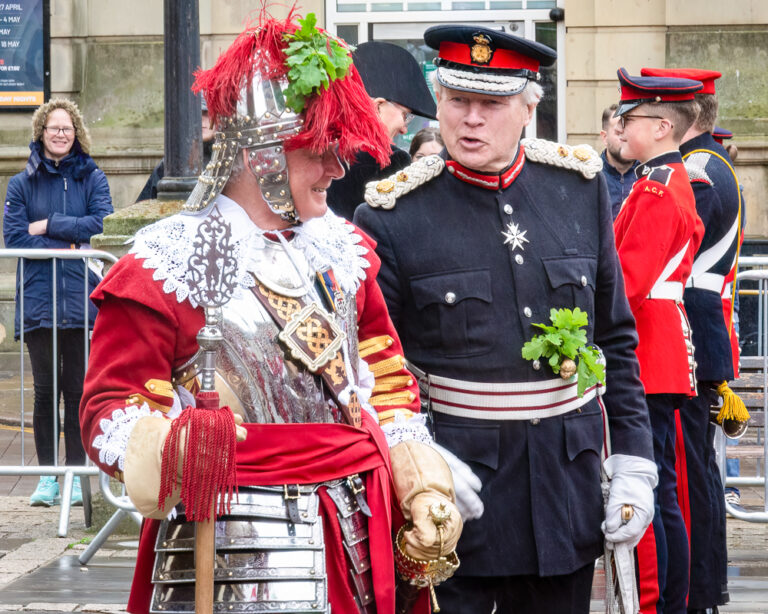 Lord Lieutenant David Laing CBE talking to a member of the HAC at Oak Apple Day in Northampton 2019